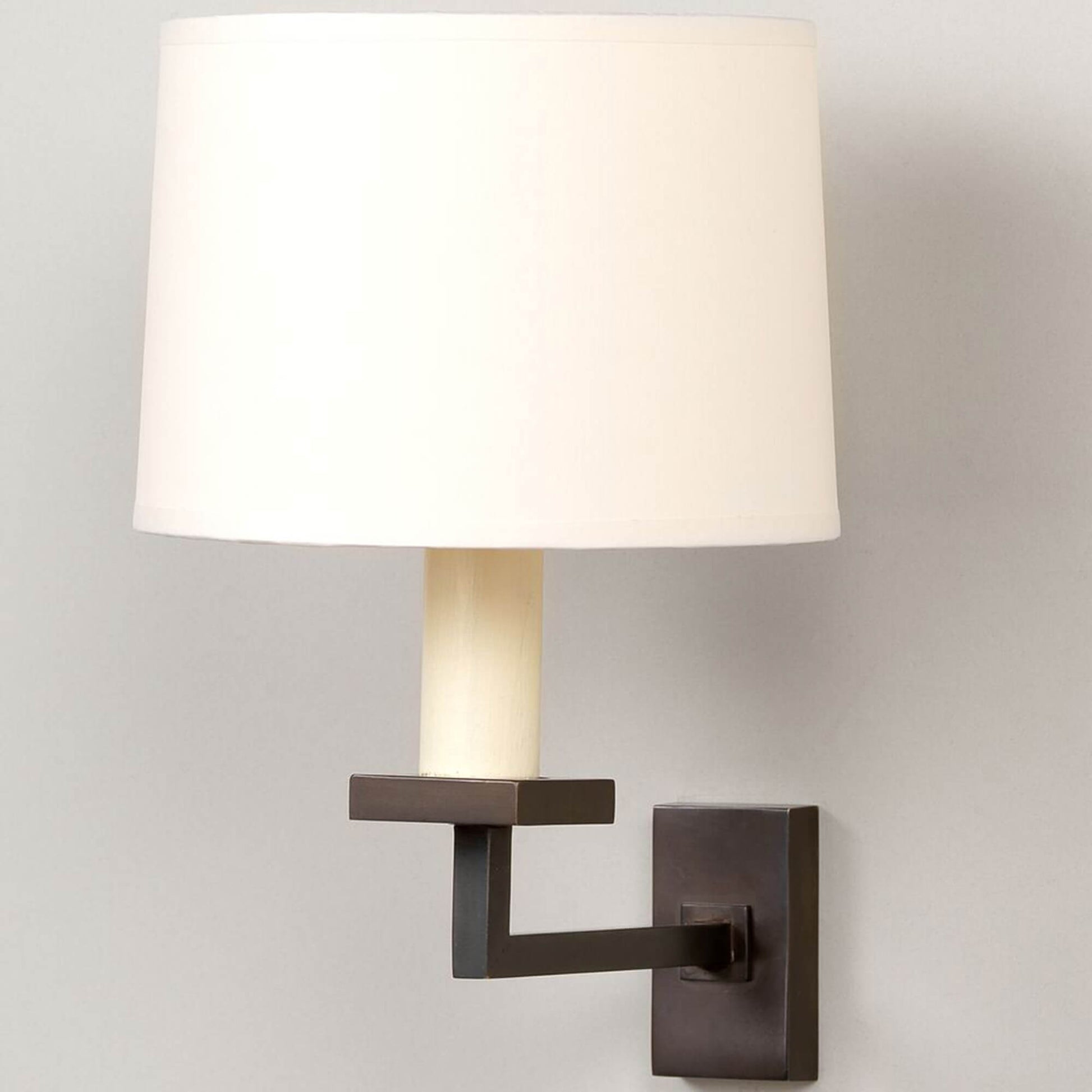 Fixed library wall light in bronze with white shade