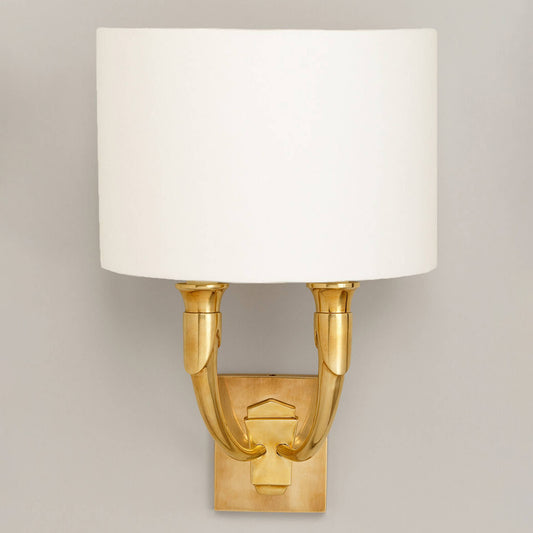 French horn wall light with large back plate in brass with lily linen shade