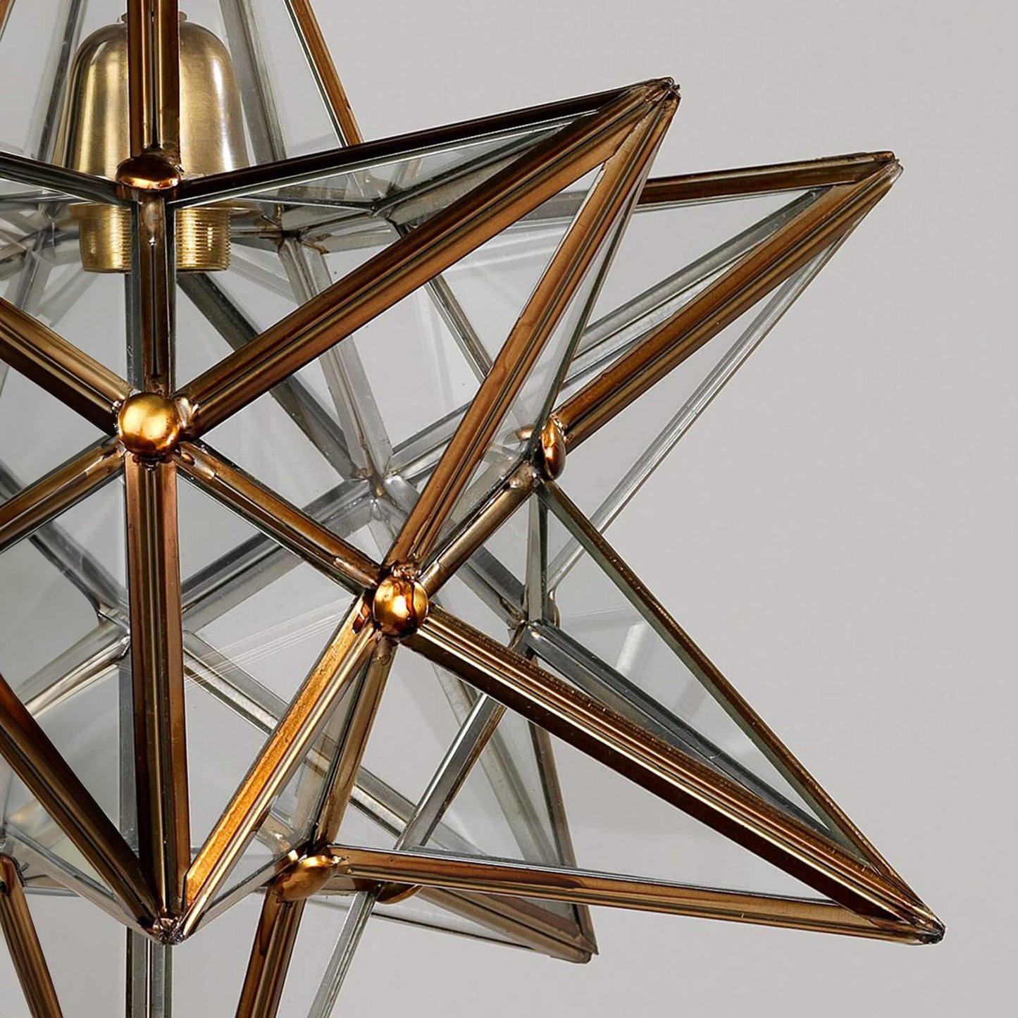 Close up of star pendant in brass