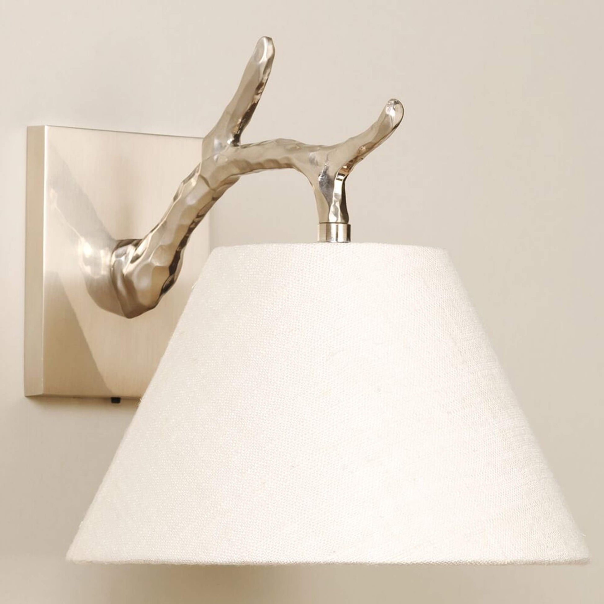 Twig Down wall light in brushed nickel with lily linen shade