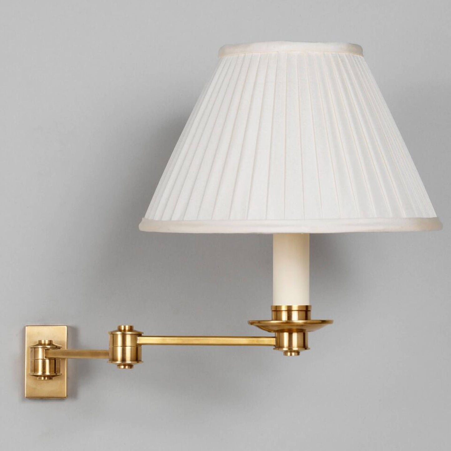 Library swing arm wall light in brass with 10" empire knife pleat shade in cream silk